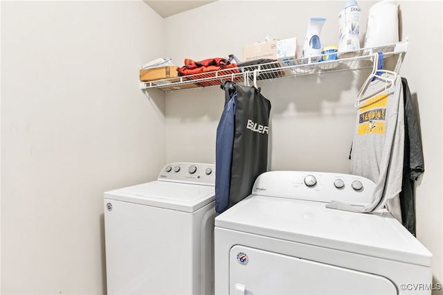 washroom with washer and dryer