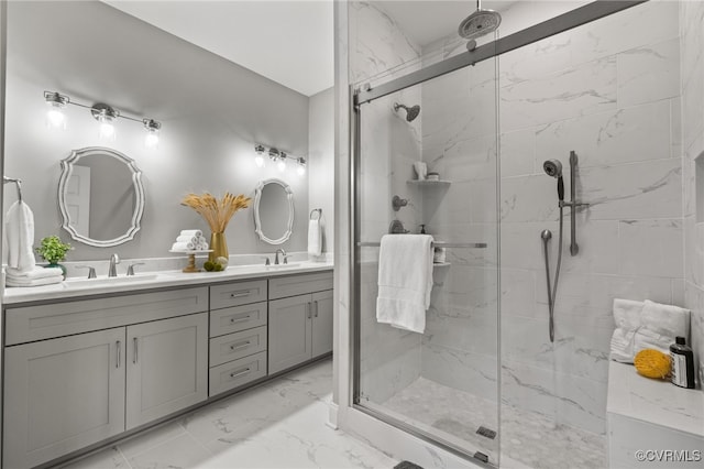 bathroom with vanity and a shower with shower door