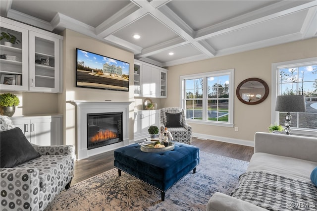 living room with beamed ceiling, dark hardwood / wood-style floors, crown molding, and coffered ceiling