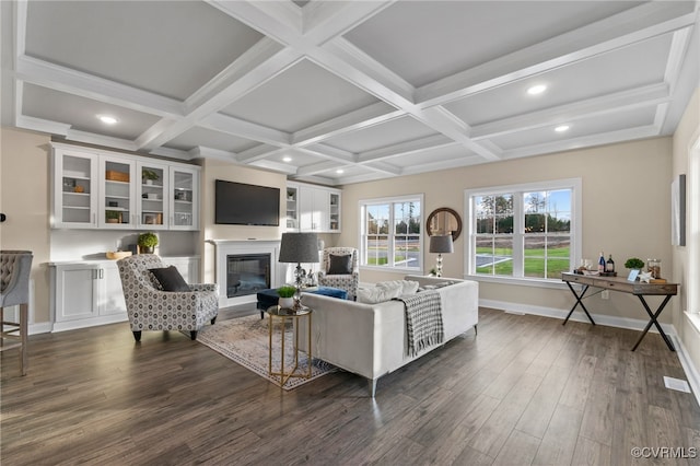 living room with beamed ceiling, dark hardwood / wood-style flooring, and coffered ceiling