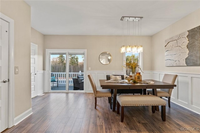 6416 Sanford Springs Cv, Midlothian, VA 23112 - dining space featuring a decorative wall, healthy amount of natural light, dark wood finished floors, and a wainscoted wall