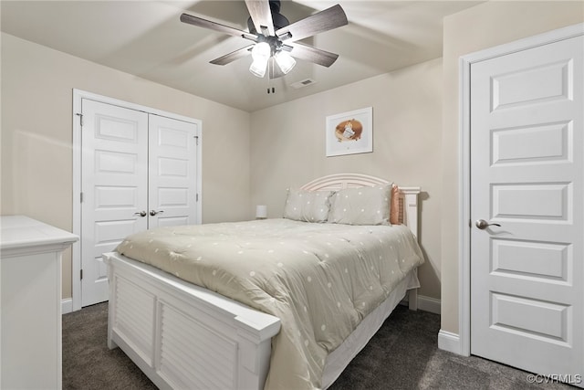 carpeted bedroom with ceiling fan and a closet