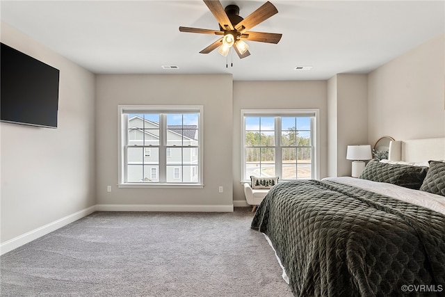 carpeted bedroom featuring ceiling fan