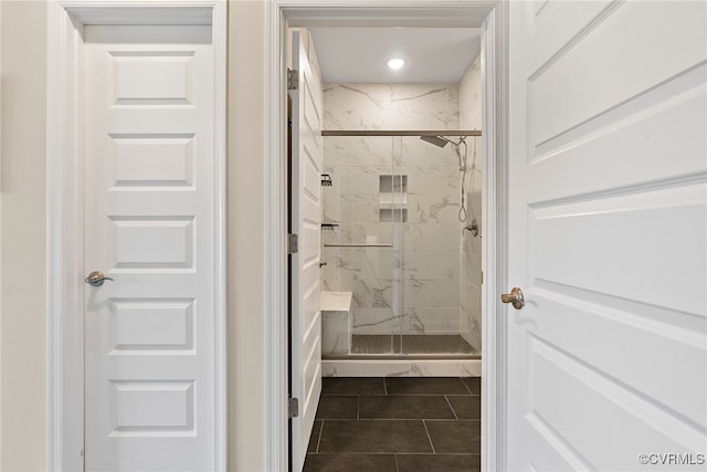 bathroom with tile patterned floors and walk in shower