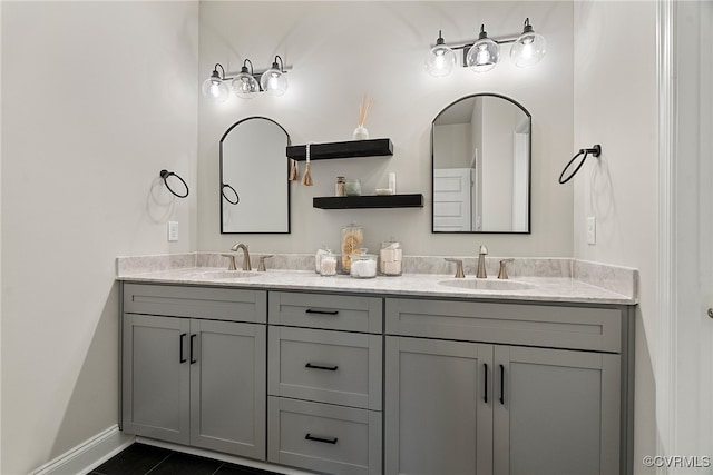 bathroom featuring tile patterned flooring and vanity