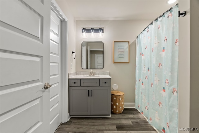 bathroom featuring hardwood / wood-style floors and vanity