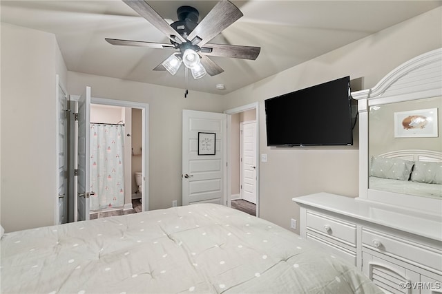 bedroom featuring ensuite bath and ceiling fan