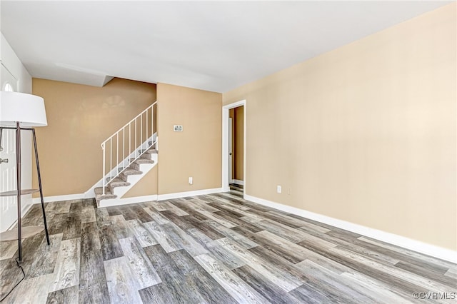 unfurnished room with hardwood / wood-style floors