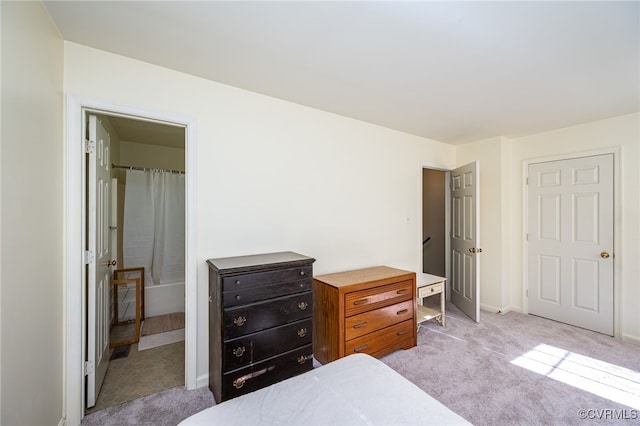 bedroom featuring light colored carpet