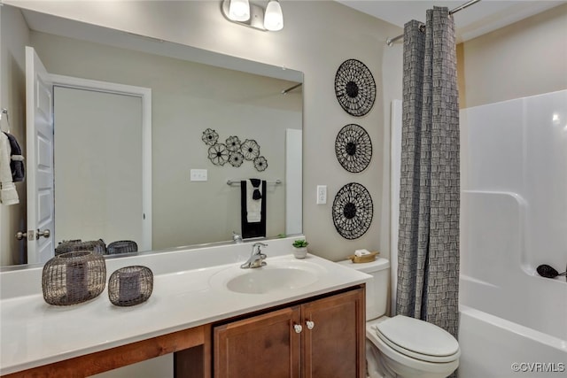 full bathroom featuring vanity, shower / tub combo with curtain, and toilet