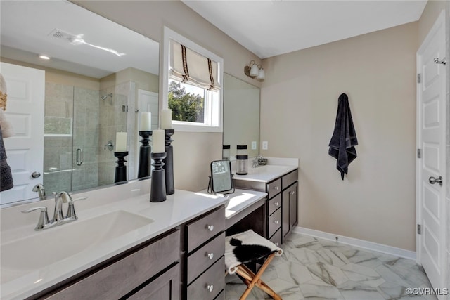 bathroom with vanity and a shower with door