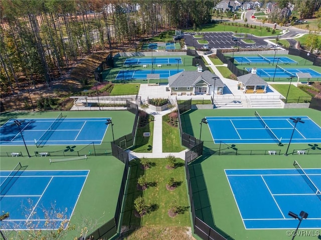 view of sport court featuring fence