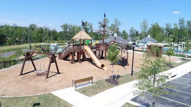 view of playground featuring a water view