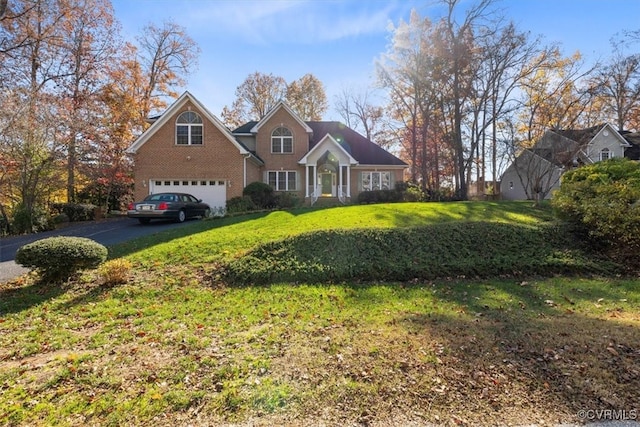 view of front facade with a garage and a front lawn