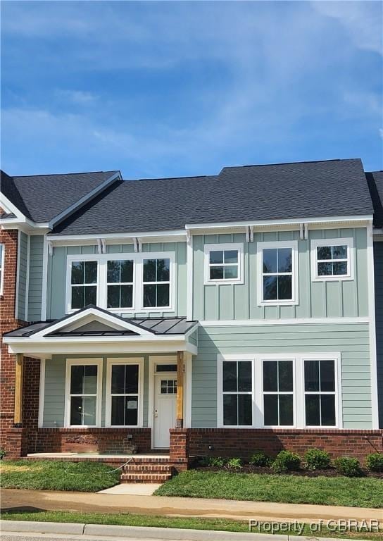 4396 Battery Blvd, Williamsburg, VA 23185 - view of front of house with board and batten siding and brick siding