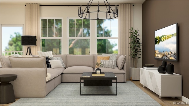 living room with light wood-type flooring and a chandelier