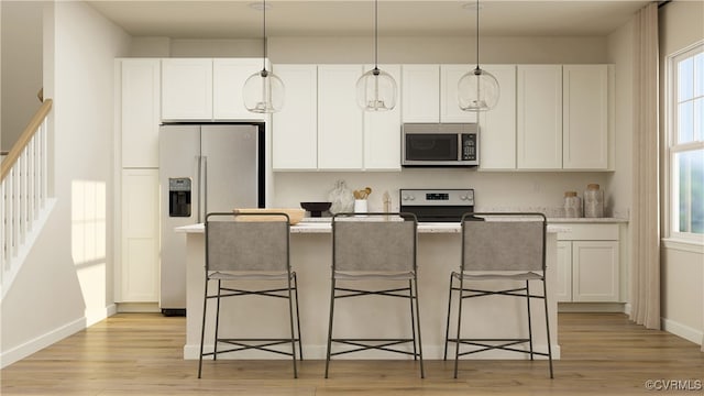 kitchen with a center island with sink, light wood-type flooring, white cabinetry, and stainless steel appliances