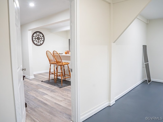 hall with hardwood / wood-style floors