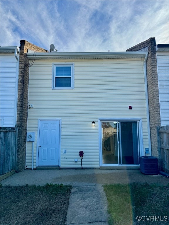 back of property featuring central air condition unit