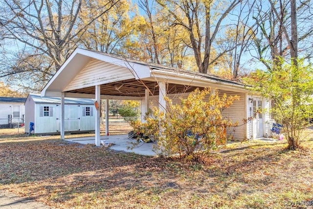 exterior space featuring a carport and a shed