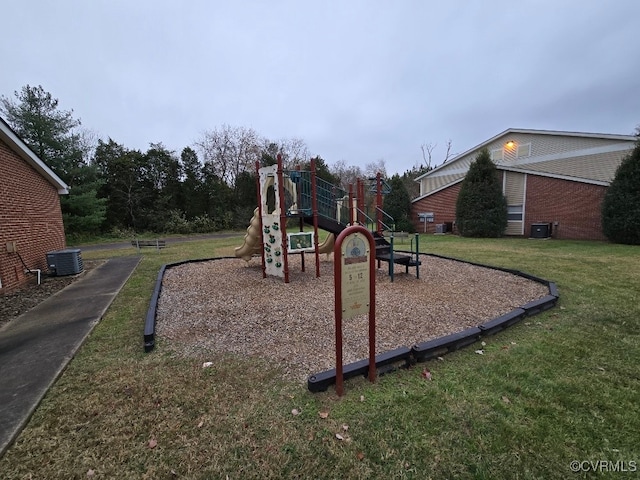 view of playground with a yard and central AC