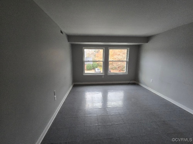 empty room featuring a textured ceiling