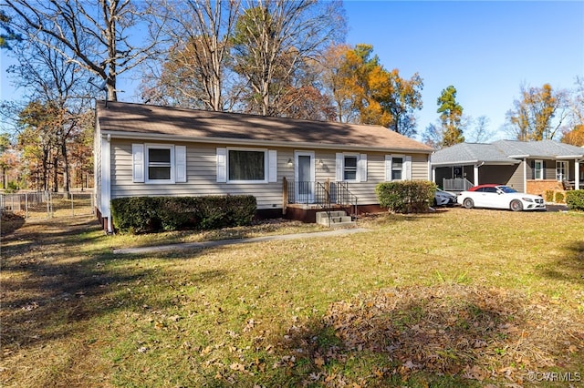 single story home featuring a front lawn