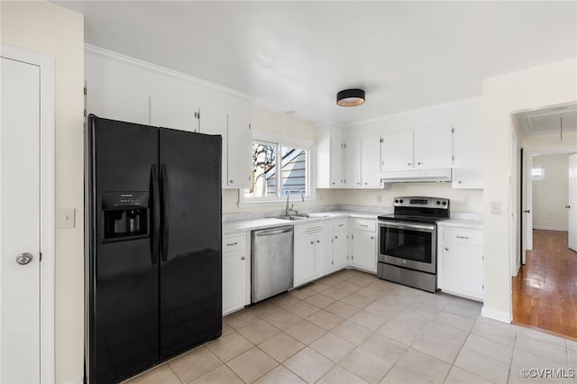 kitchen with white cabinetry, sink, ornamental molding, and appliances with stainless steel finishes