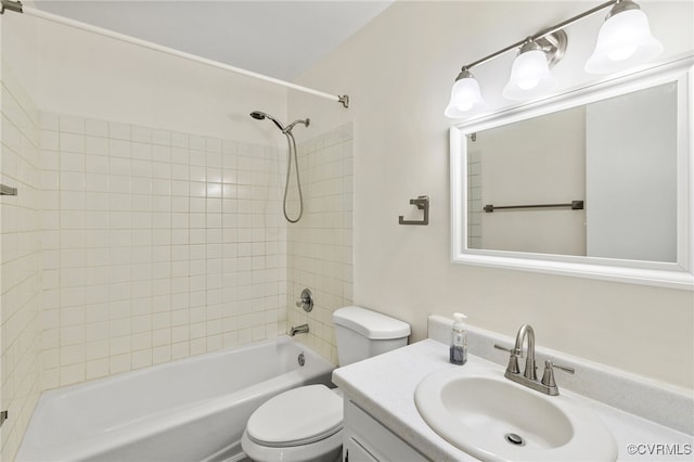 full bathroom featuring vanity, toilet, and tiled shower / bath combo