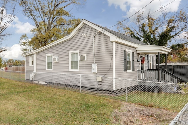 view of side of home featuring a lawn