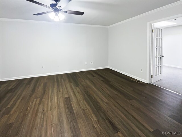 empty room with dark hardwood / wood-style floors, ceiling fan, and ornamental molding