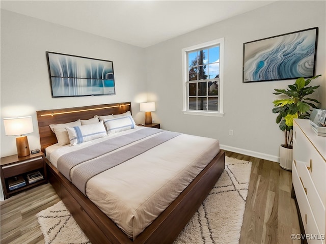 bedroom with light wood-type flooring