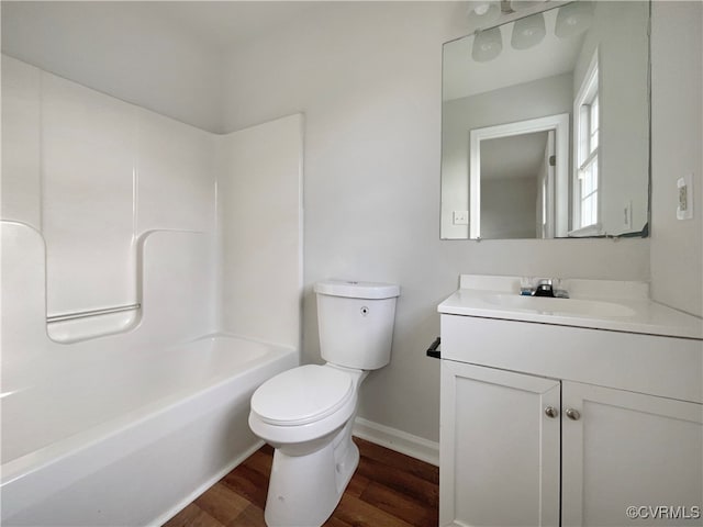 full bathroom with toilet, vanity, shower / bath combination, and hardwood / wood-style flooring