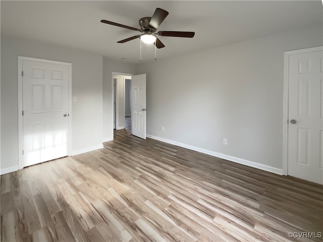 unfurnished bedroom with hardwood / wood-style floors and ceiling fan