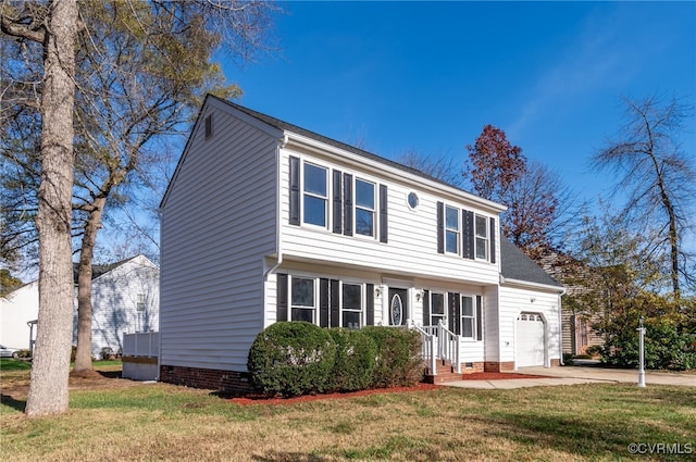 colonial home with a garage and a front lawn