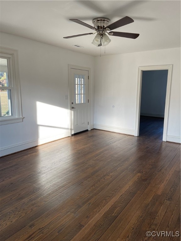 unfurnished room featuring ceiling fan and dark hardwood / wood-style flooring