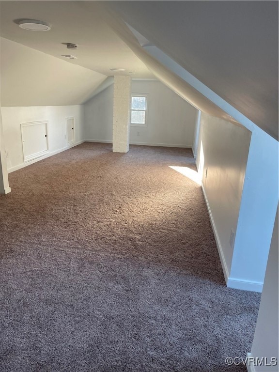 bonus room with carpet flooring and lofted ceiling