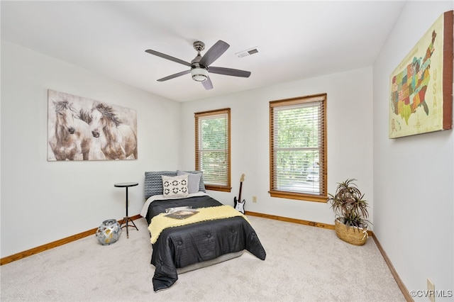 carpeted bedroom featuring ceiling fan