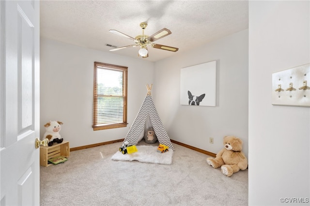 373 Land Or Dr, Ruther Glen, VA 22546 - rec room featuring carpet floors, a textured ceiling, baseboards, and ceiling fan