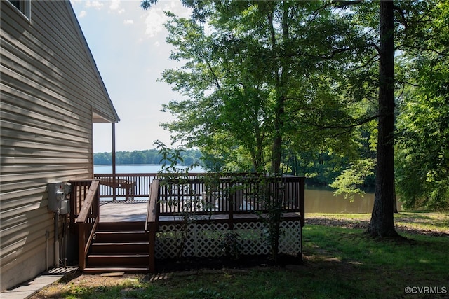 wooden deck featuring a water view