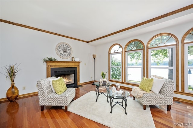 living room with hardwood / wood-style flooring and crown molding