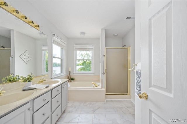 bathroom with shower with separate bathtub and vanity