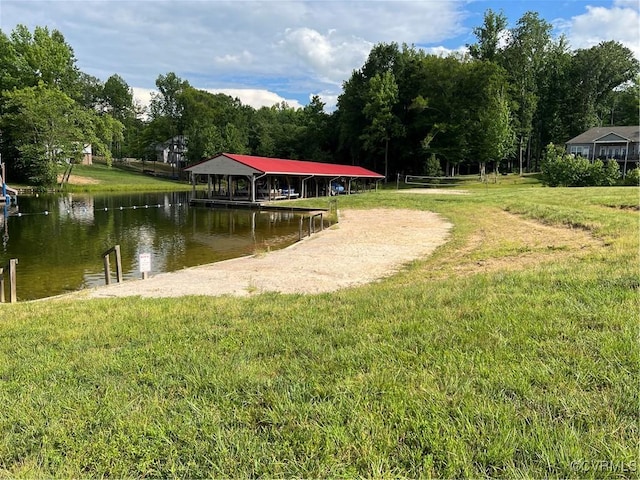 view of dock featuring a yard and a water view