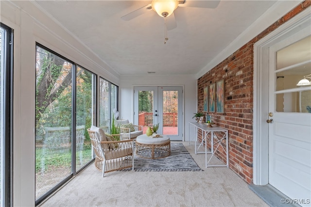 sunroom / solarium with ceiling fan