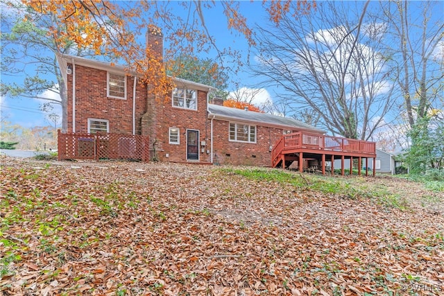 rear view of property with a wooden deck