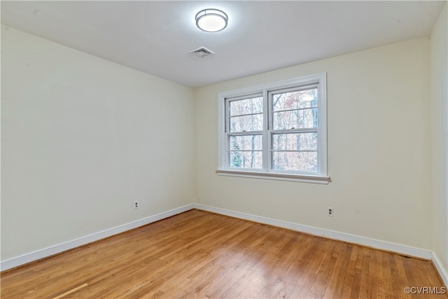 spare room featuring light hardwood / wood-style flooring