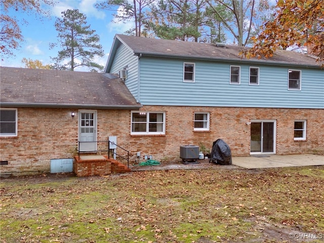 back of house with a patio and central AC