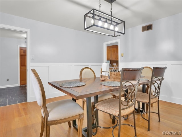 dining room with wood-type flooring