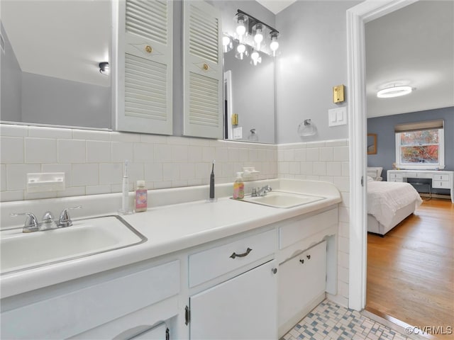 bathroom with hardwood / wood-style floors and vanity