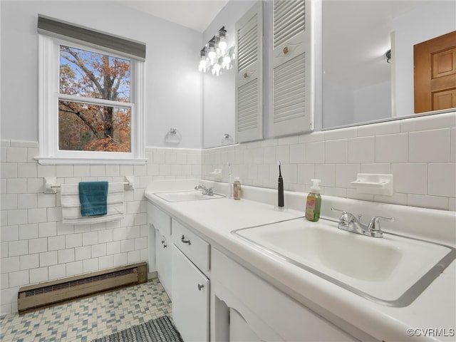 bathroom with vanity, tile walls, and a baseboard heating unit